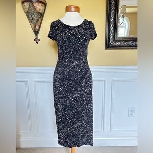 Short fitted stretchy cap sleeved black pattern dress. Size M.